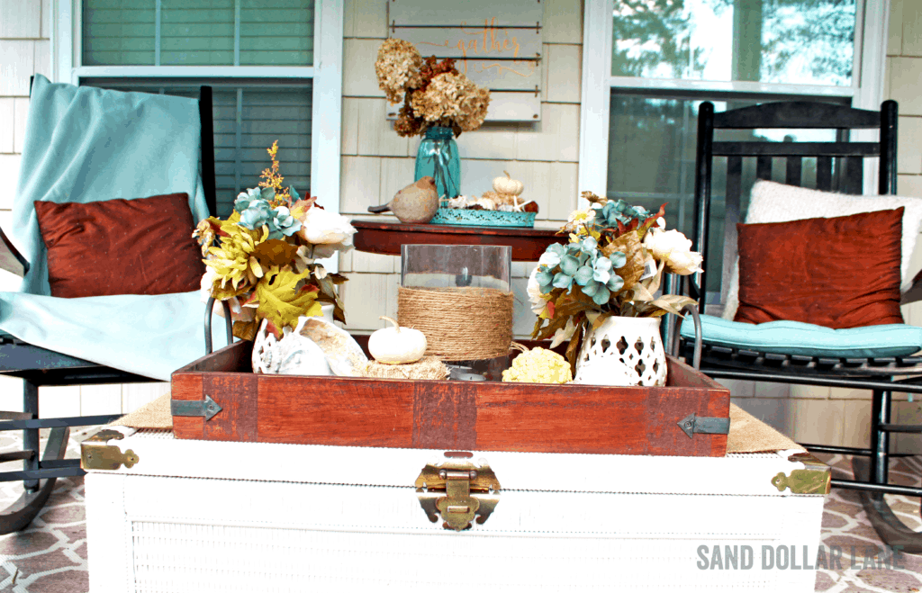 comfy front porch decorated for Fall