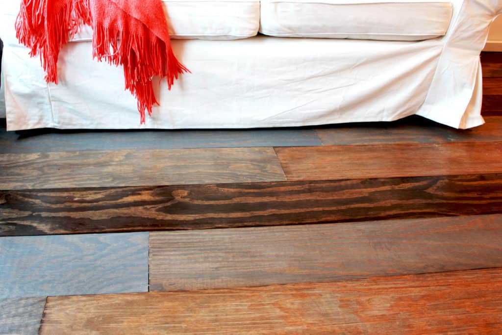 white couch on beautiful wood flooring