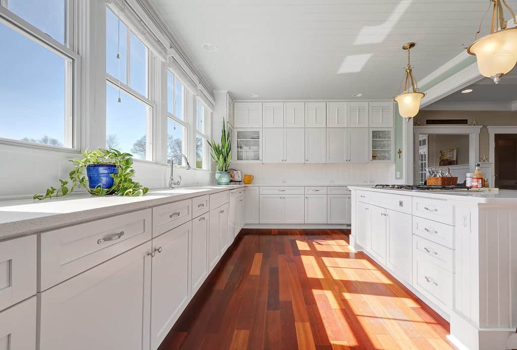 white kitchen with wooden floors