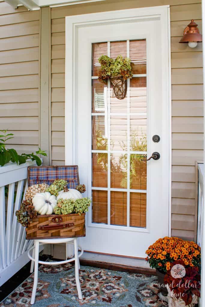 small porch decorated for Fall