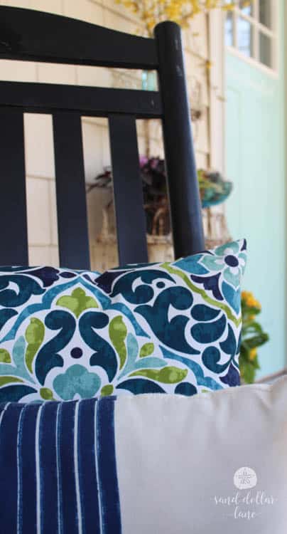 bright colorful pillow on front porch