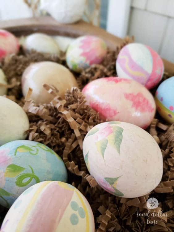 hand painted easter eggs in dough bowl