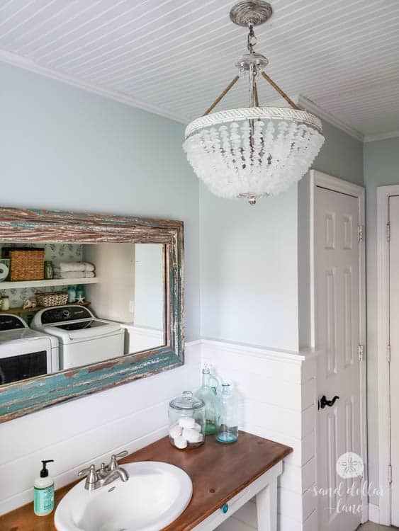 coastal bathroom with sea glass chandelier