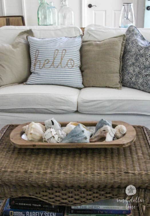 seashells in dough bowl on wicker table