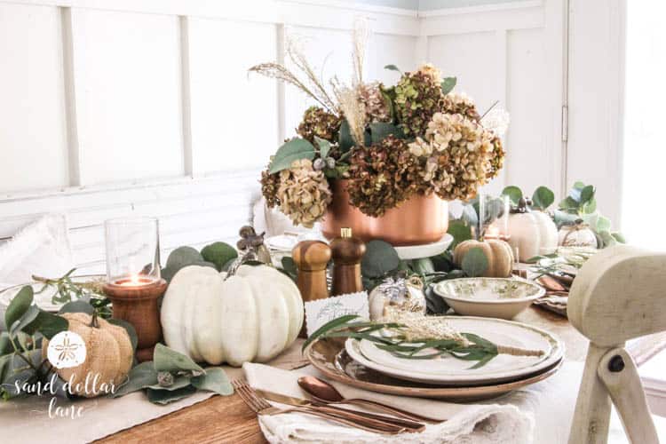 fall table with white pumpkin