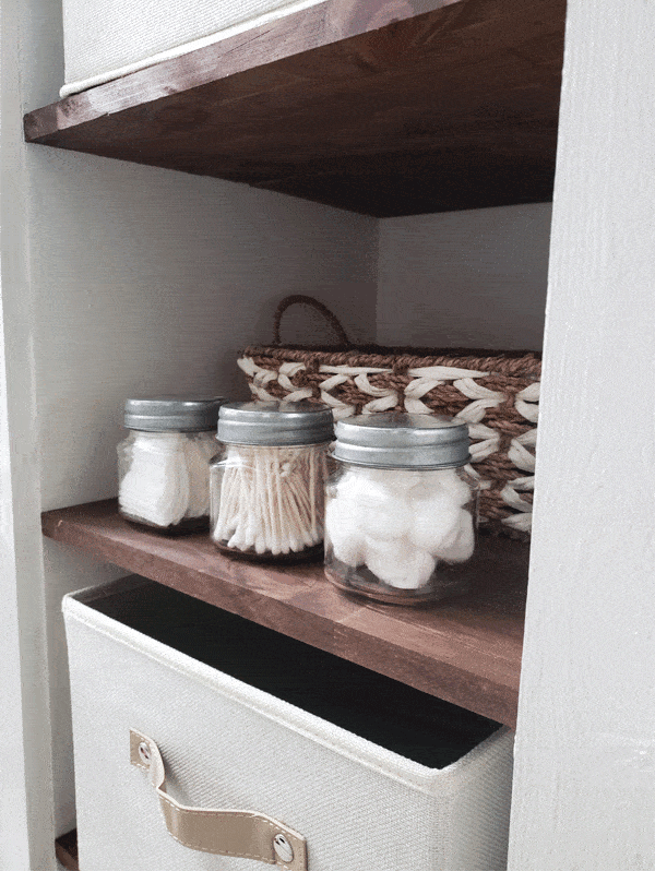 bathroom accessories in glass jars