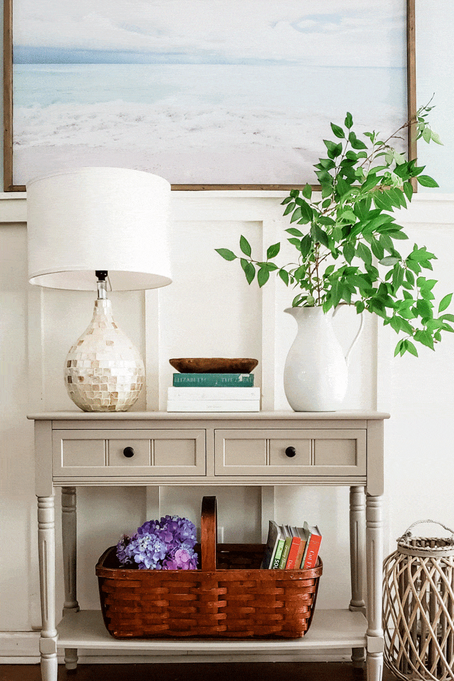 grey entryway table decorated for summer