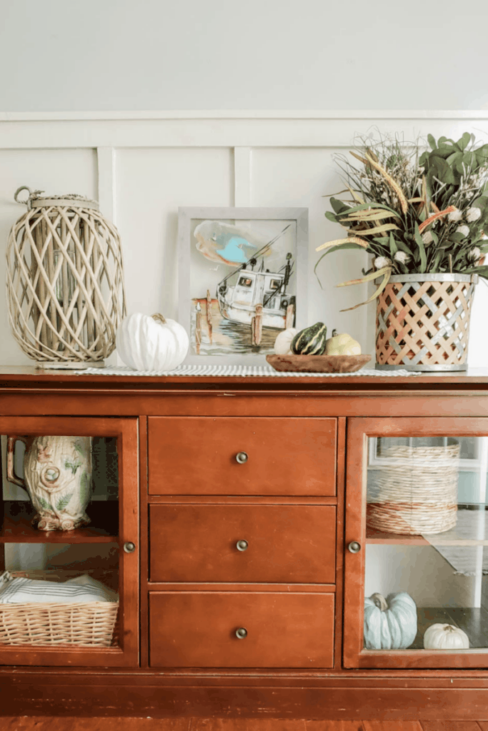 wooden buffet decorated for fall