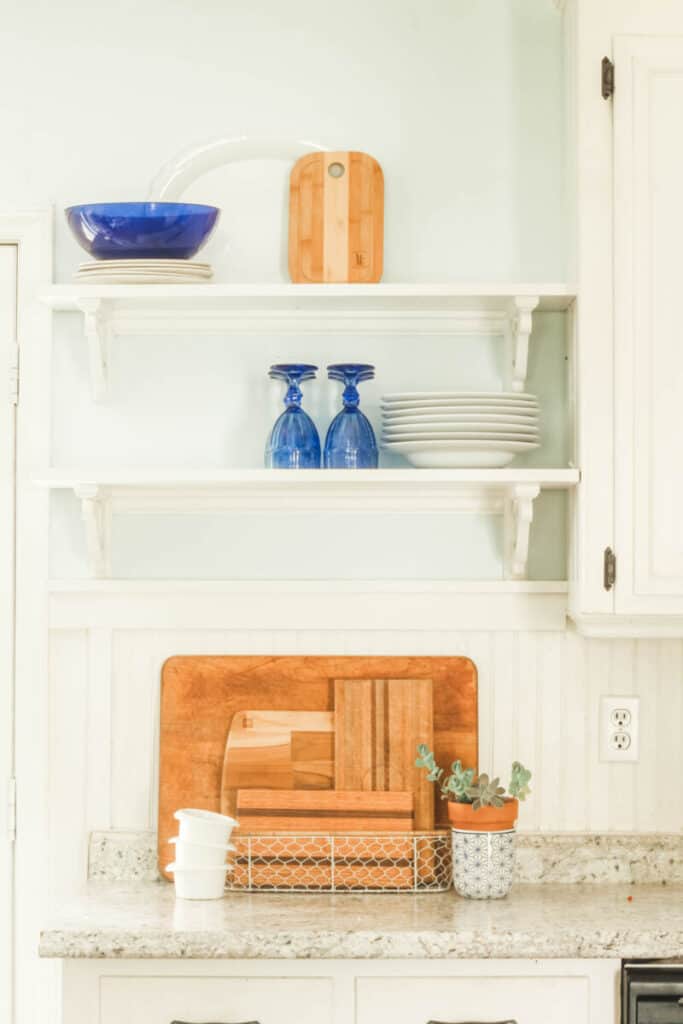 cobalt blue accessories on kitchen shelves