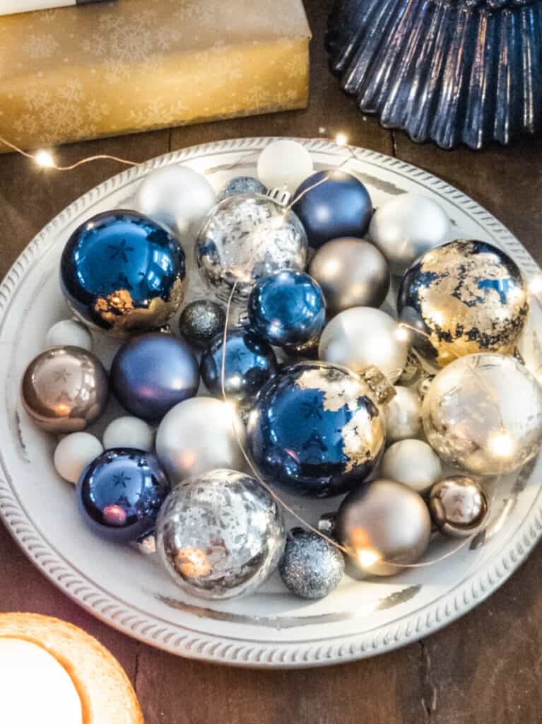 bowl of blue and gold Christmas decorations