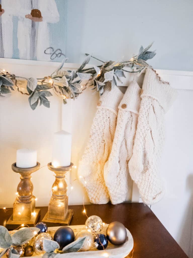 cream Pottery Barn Stockings in blue dining room