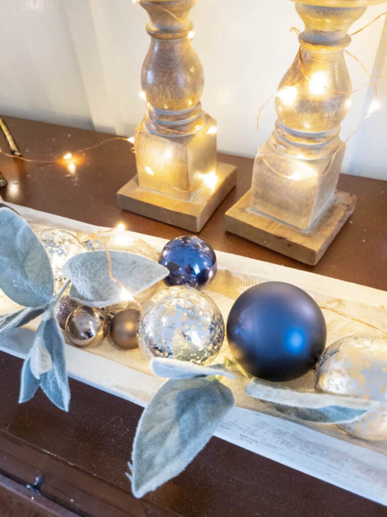 mercury glass and navy blue glass ornaments in dough bowl