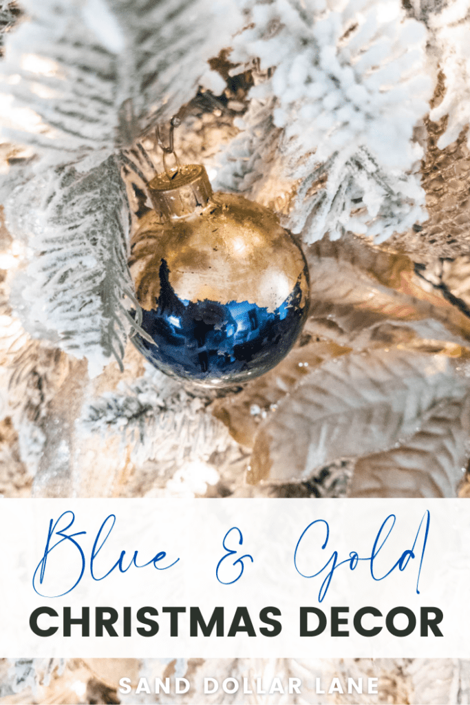 navy blue ornament with gold leaf on flocked Christmas tree