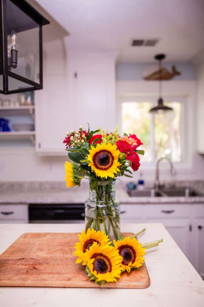 sunflowers in blue and white kitchen