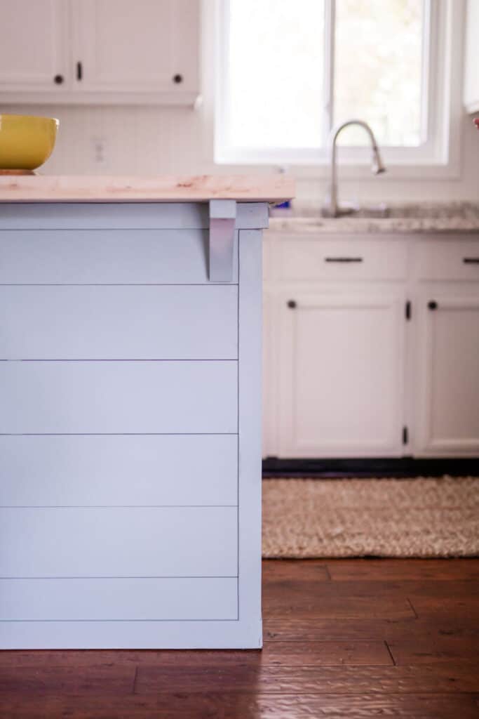 blue shiplap kitchen island in coastal kitchen