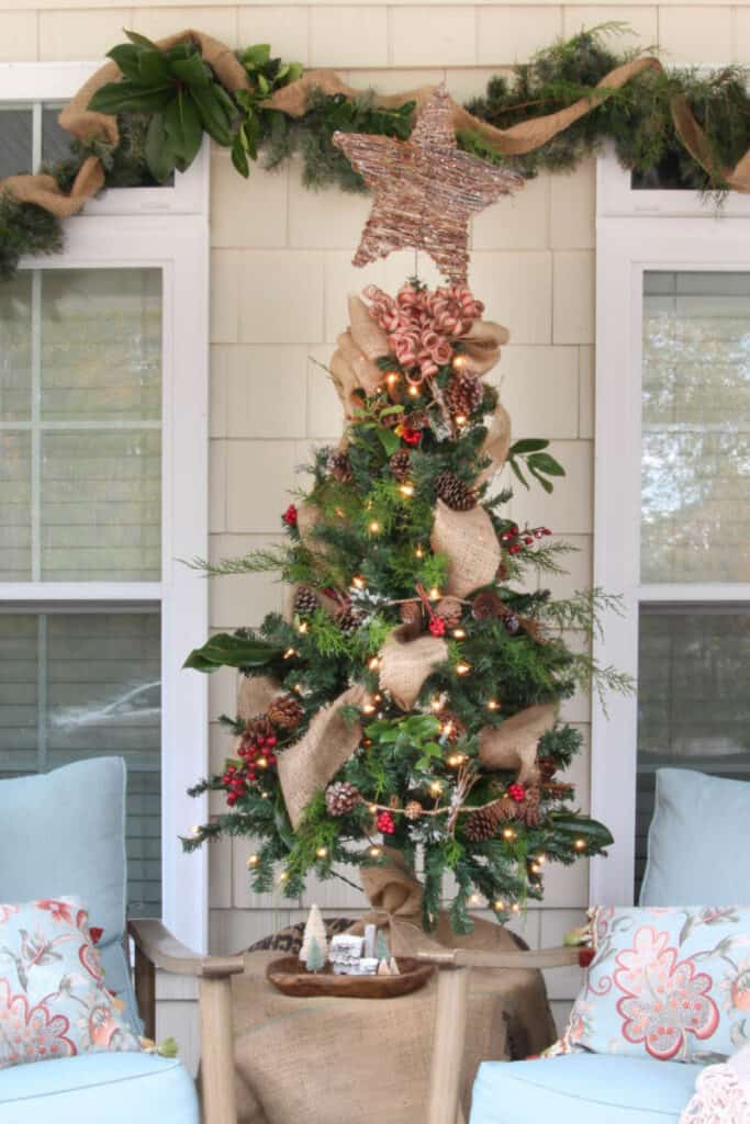 natural Christmas tree on front porch