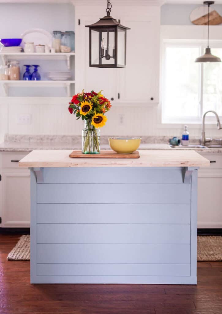 blue kitchen island in white kitchen