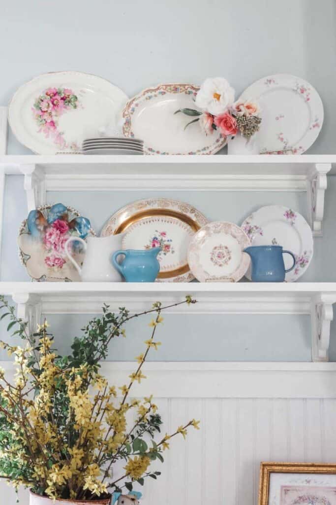 open shelving with vintage dishware