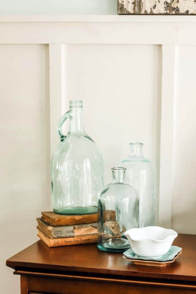 vintage glass jugs and antique books