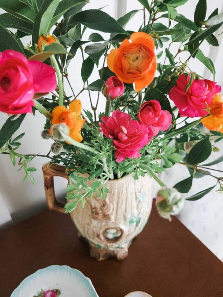 ranunculus bouquet in vintage pitcher