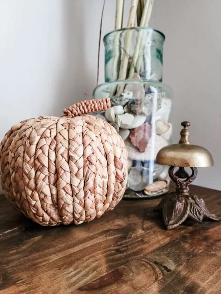 fall decorations on mudroom entryway table