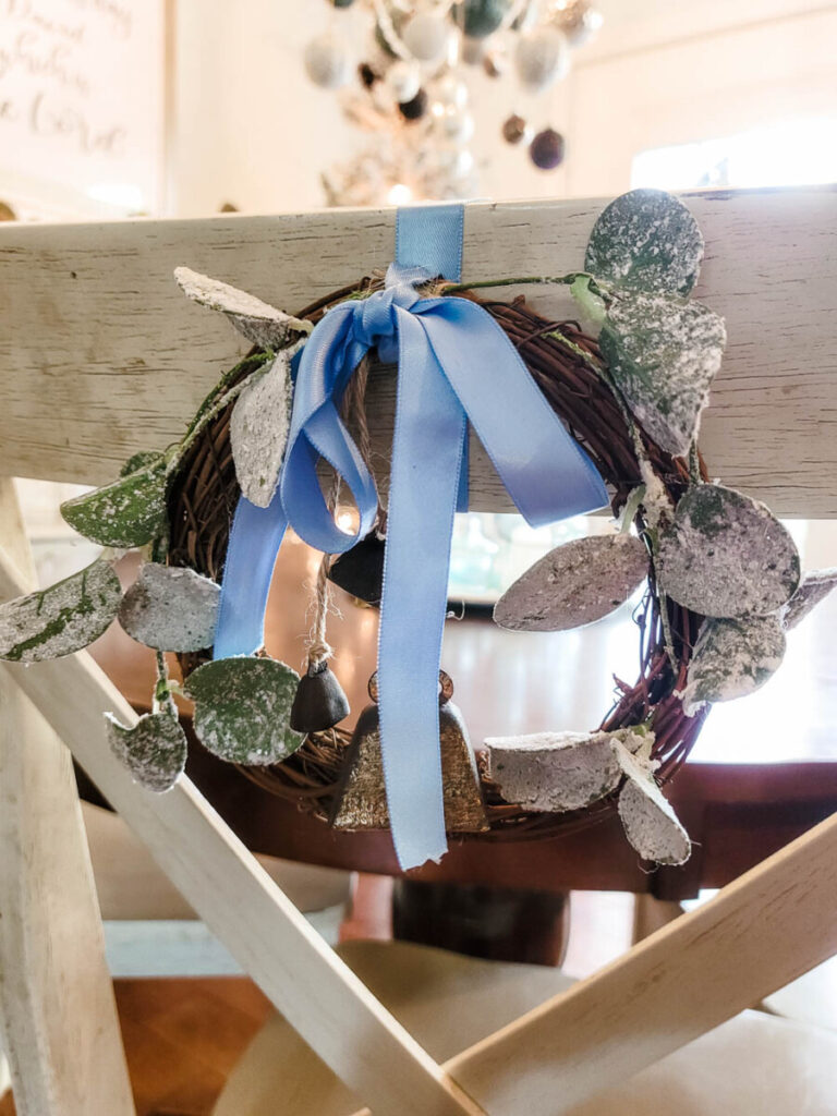 blue white wreath on back of dining room chair