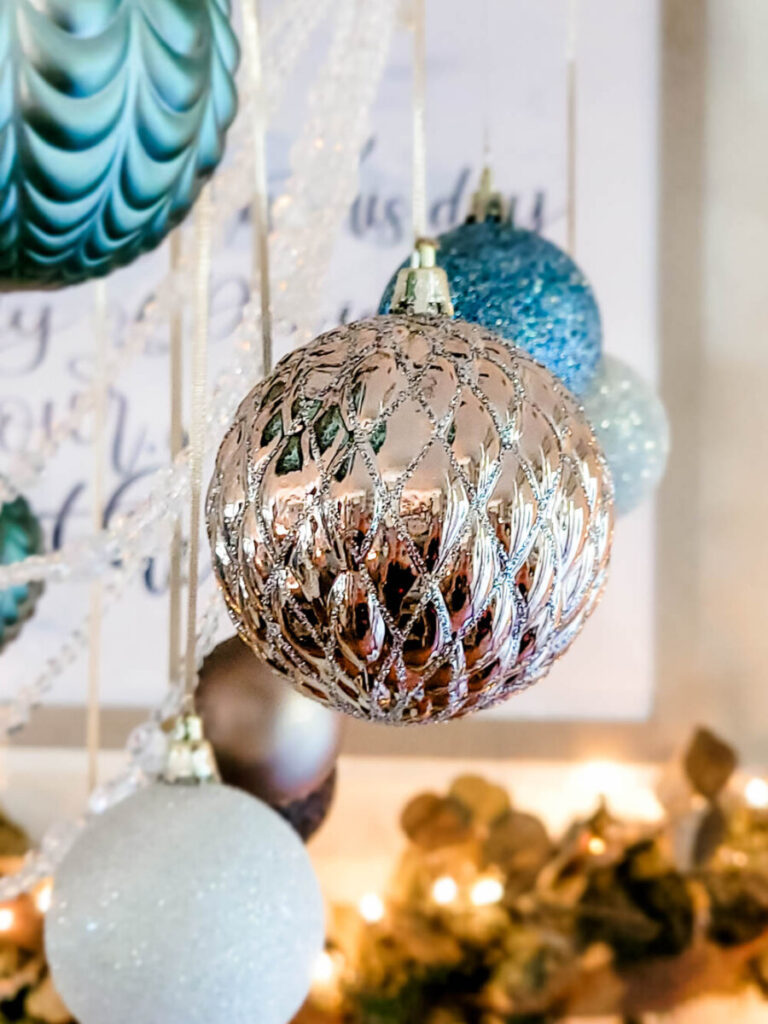 Close up of ornament hanging from dining room chandelier