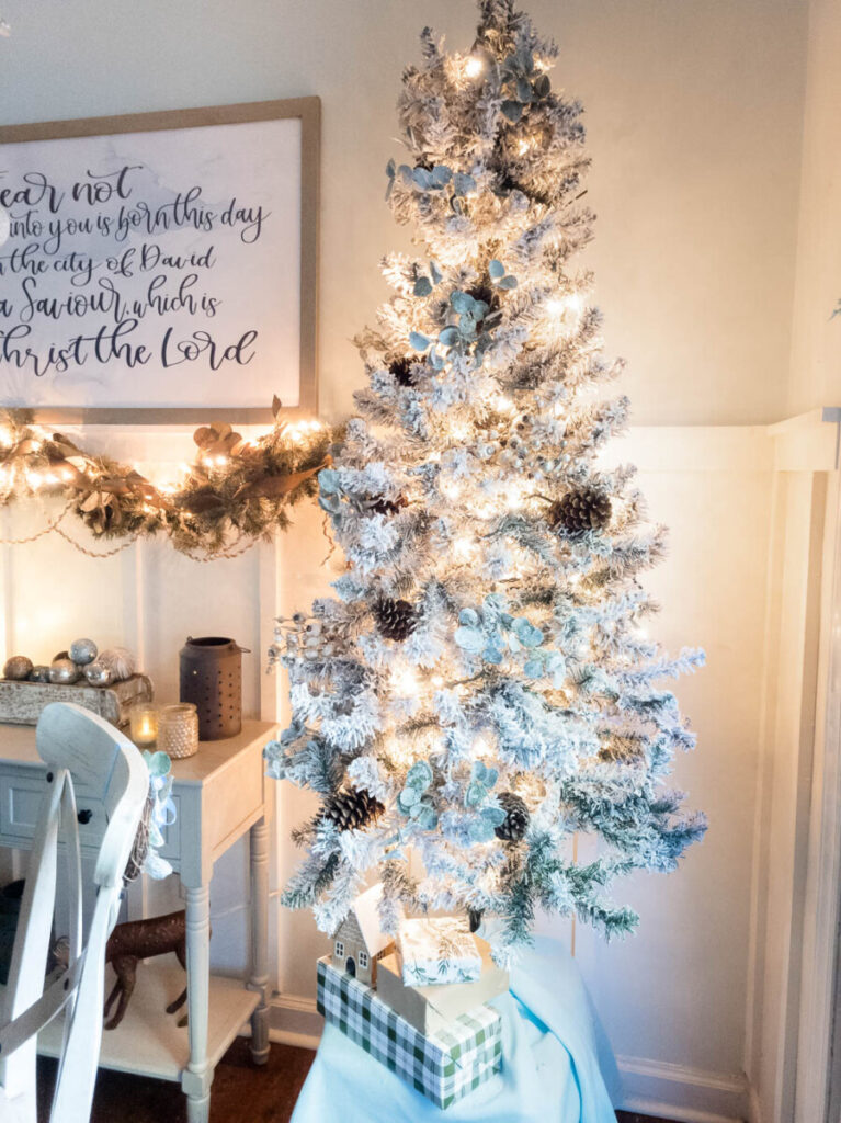 flocked Christmas tree in dining room